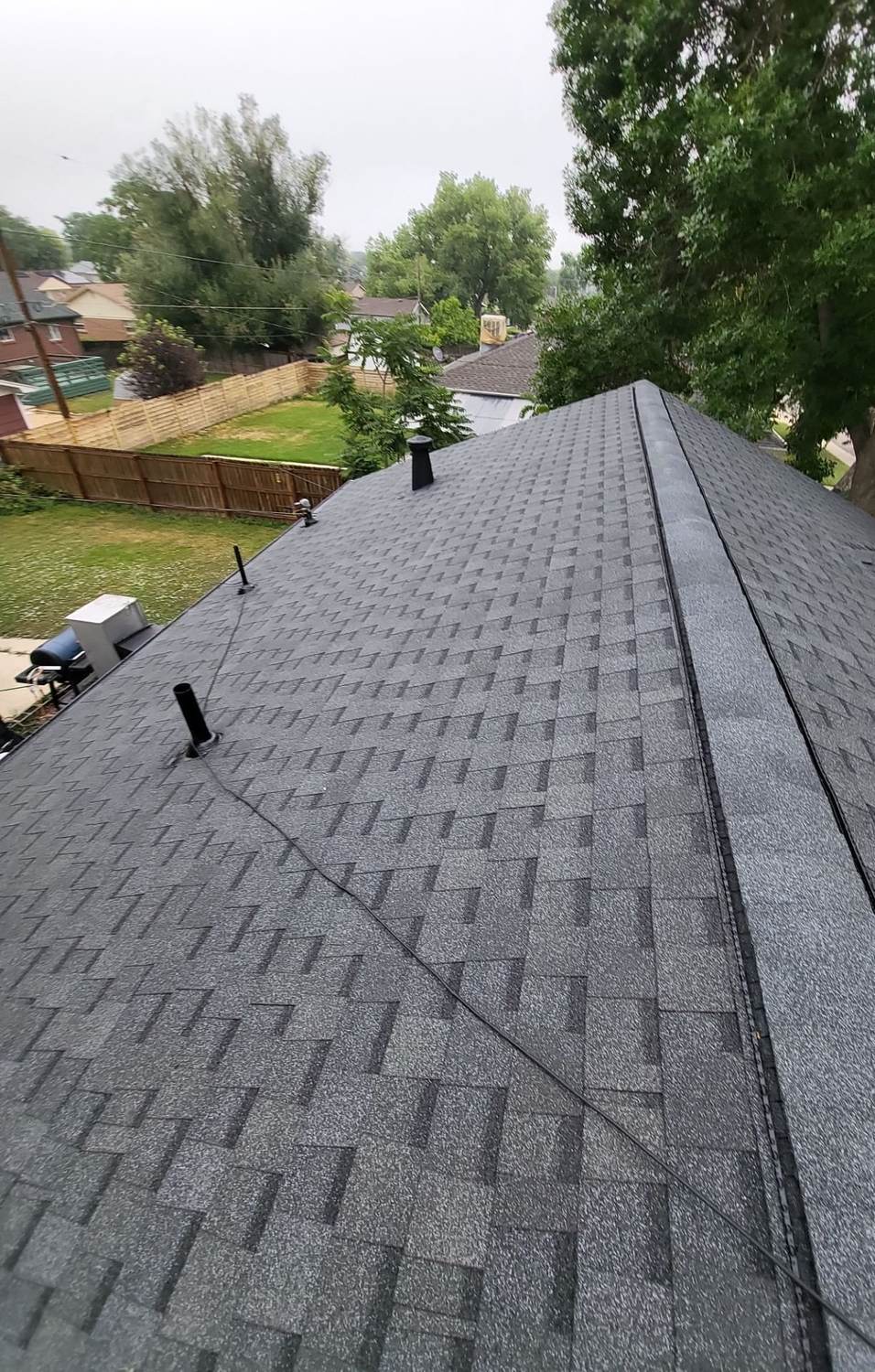 Ridge line on an asphalt shingle roof in Northglenn, CO