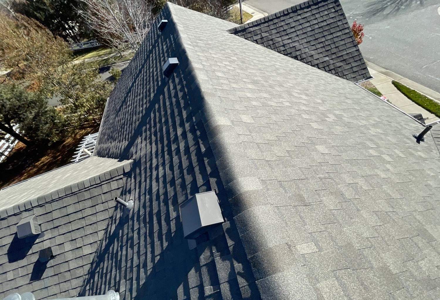 Atlas Pinnacle Impact shingle hip roof with ridge vents in Centennial, CO