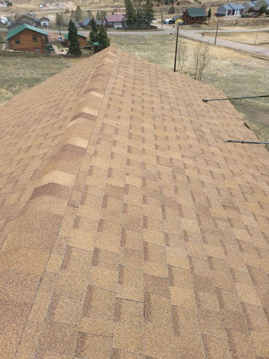 Finished ridge on an Atlas Pinnacle Impact shingle roof in Cripple Creek, CO