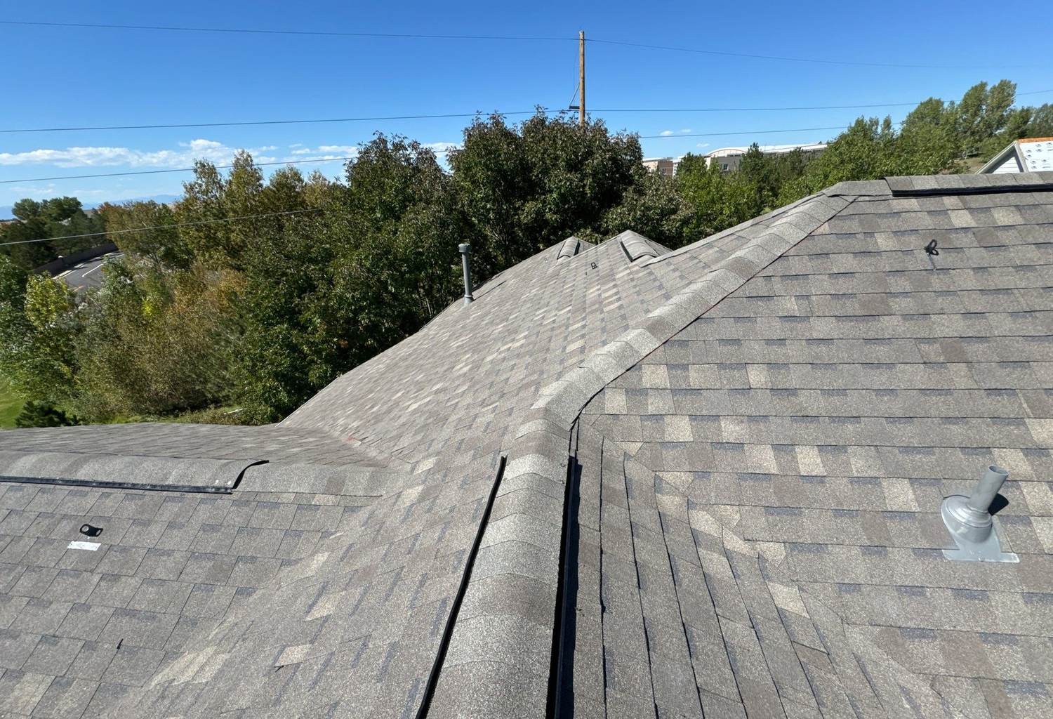Atlas Pinnacle Impact shingle roof with several ridge lines in Centennial, CO