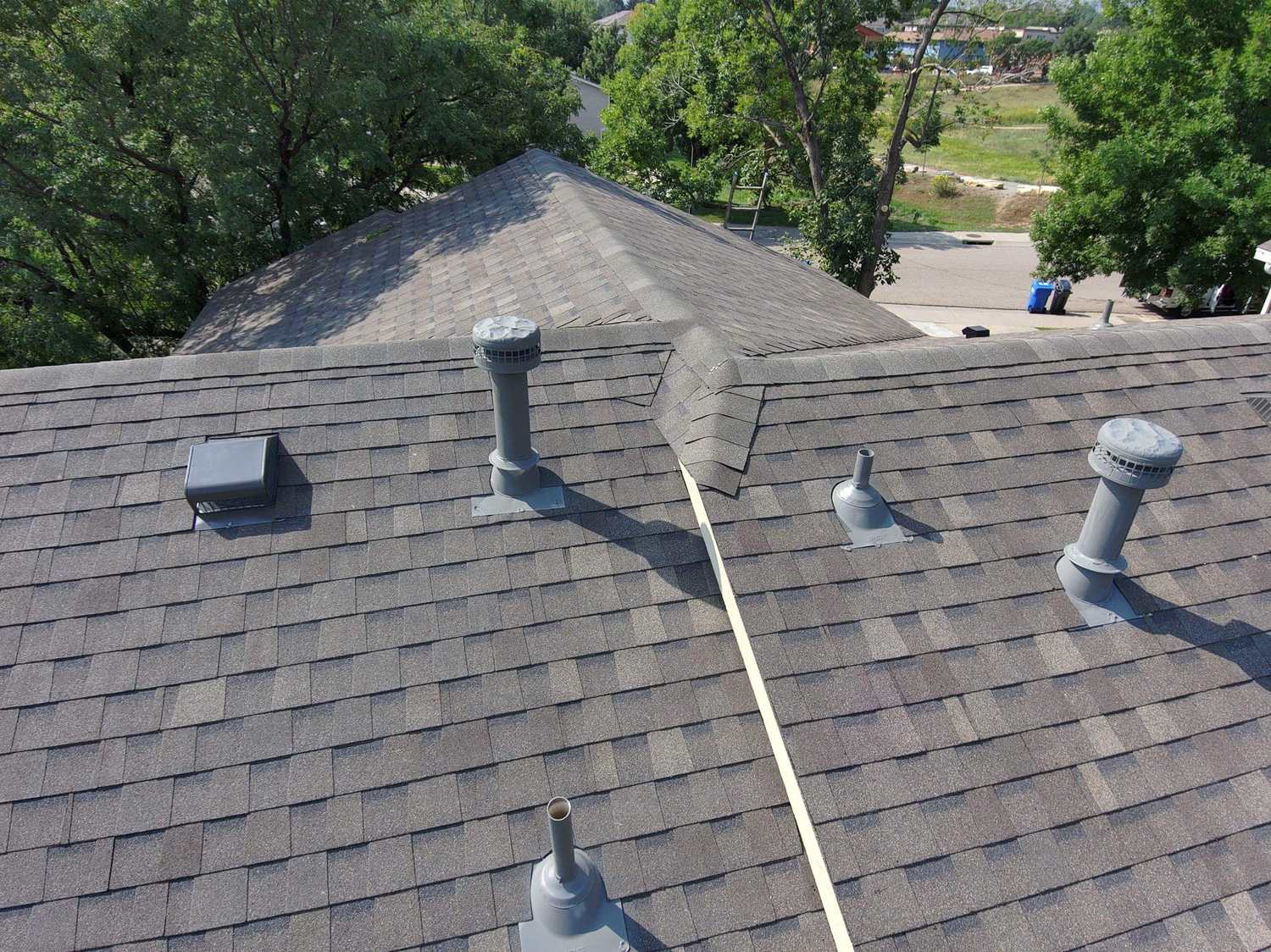 Roof vents and flashing on an Atlas Pinnacle Impact multifamily roof in Fort Collins, CO