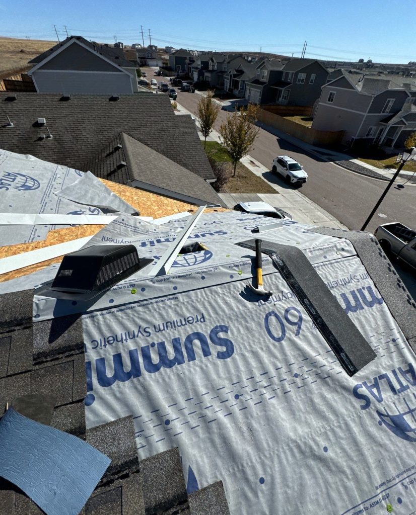 Synthetic underlayment going down during a roof replacement in Colorado Springs.