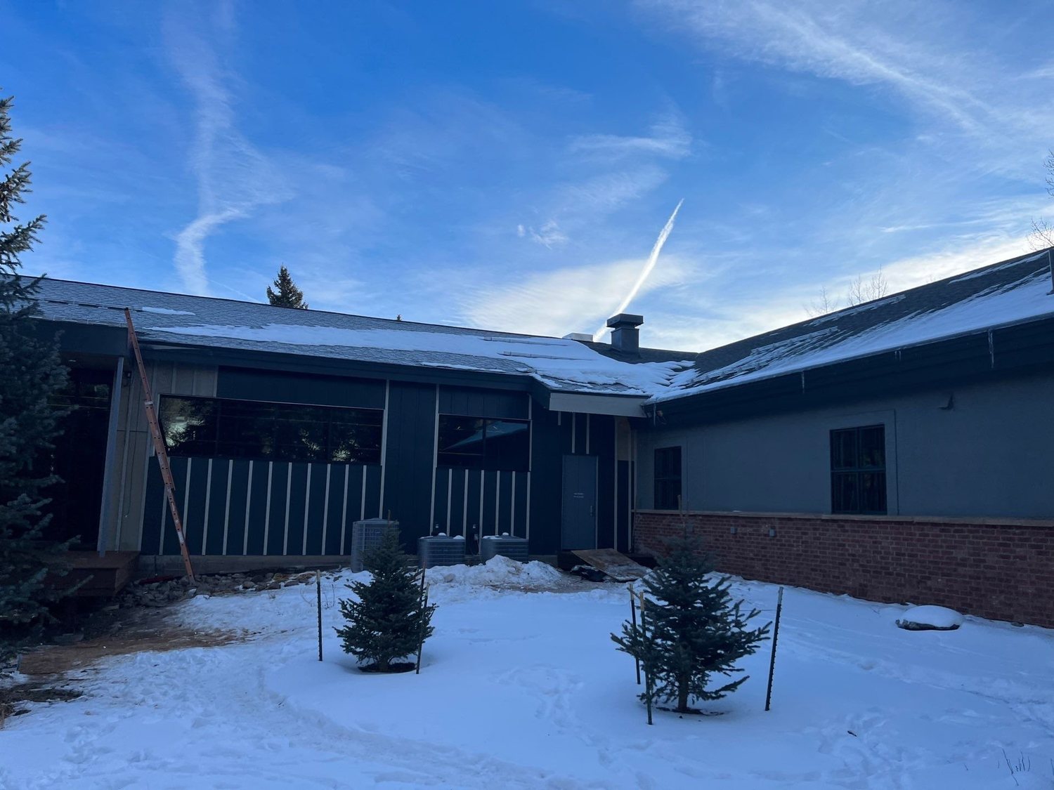 Commercial building with an asphalt shingle roof in winter in Silverthorne, CO