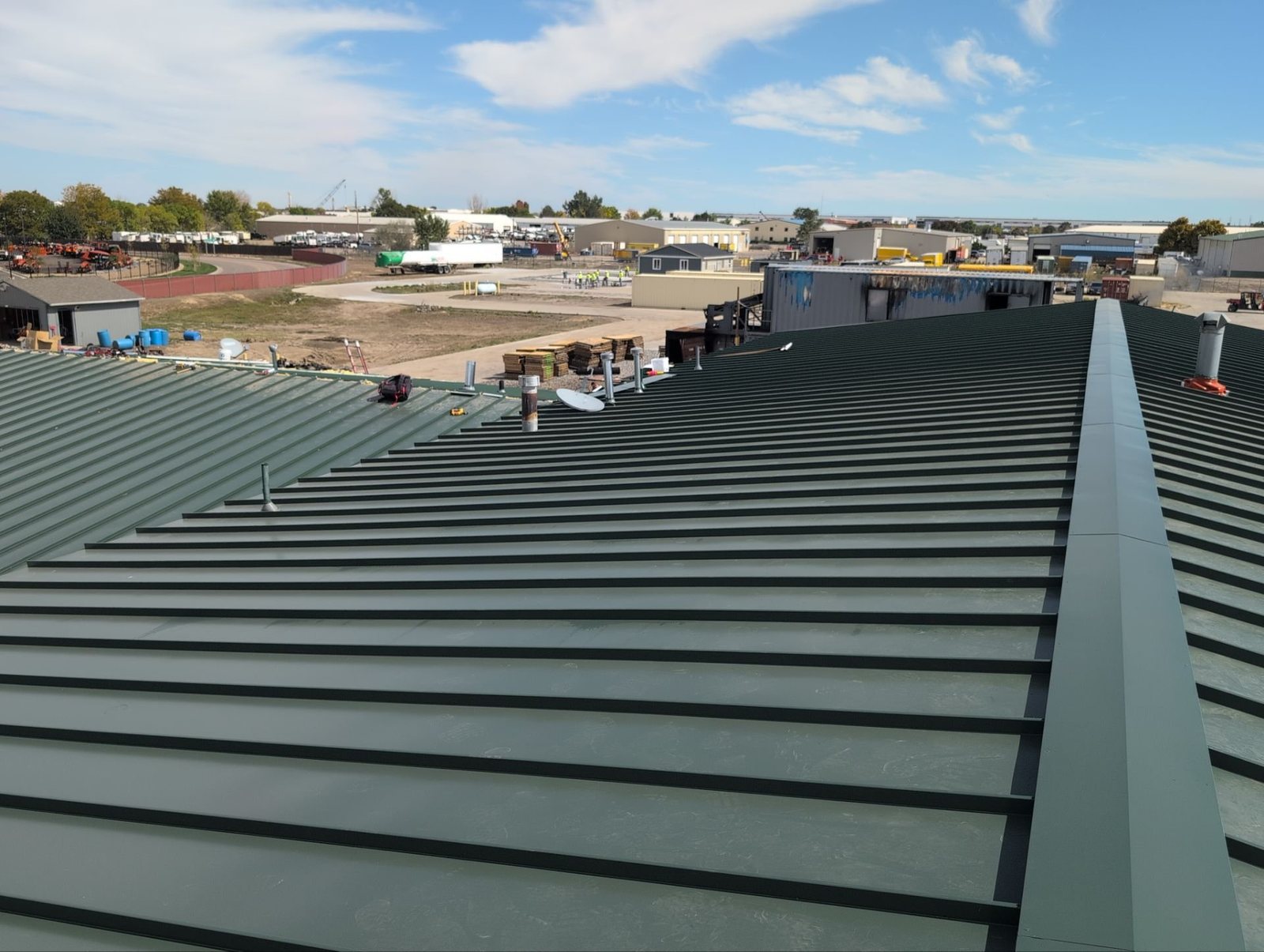 Commercial standing seam metal roof ridge in Commerce City, CO
