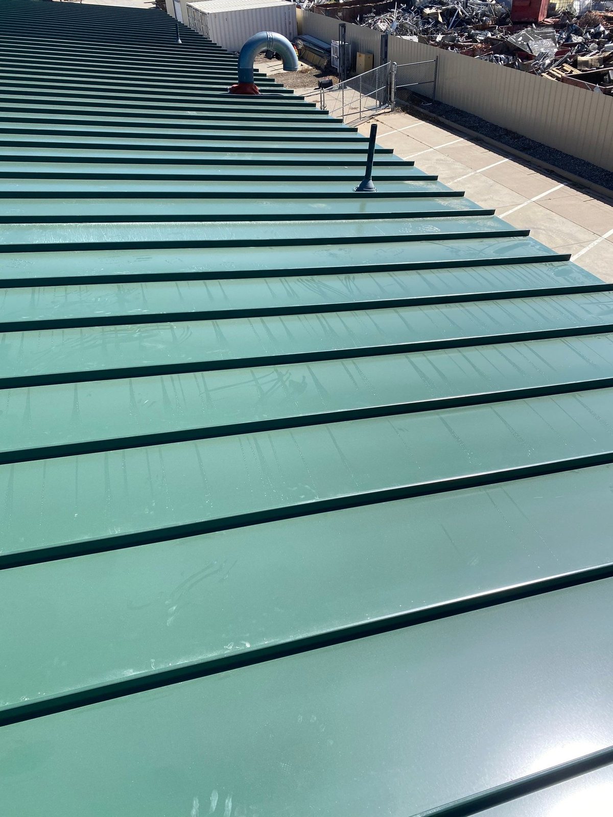 Commercial standing seam metal roof seams in Commerce City, CO