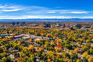 Aerial view of a Colorado Front Range neighborhood with the Rocky Mountains in the background