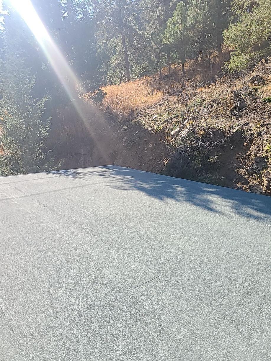 Finished granulated modified bitumen cap sheet with lap seams on a low-slope roof