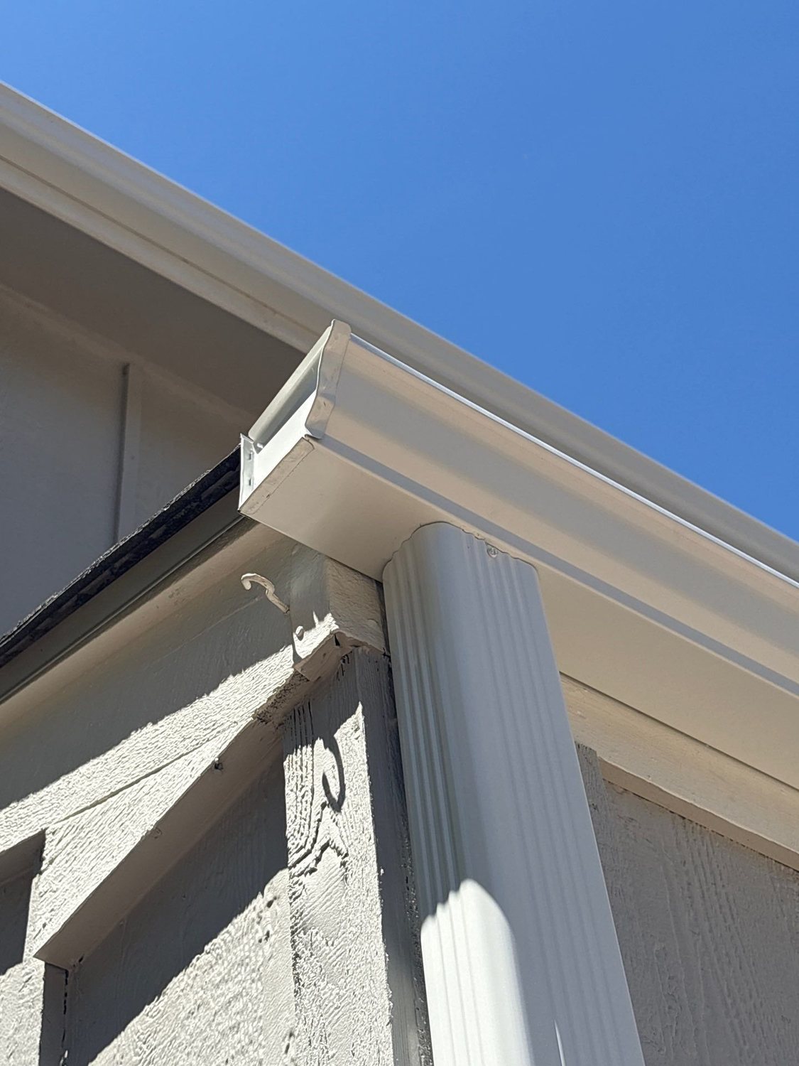 New seamless gutter and downspout on a two-story home in Littleton, CO