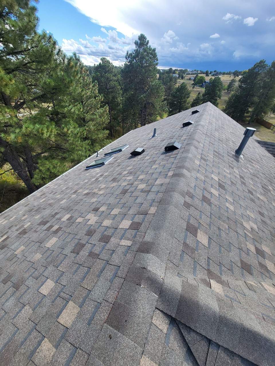 Atlas shingle roof with hip ridge and vents in Parker, CO