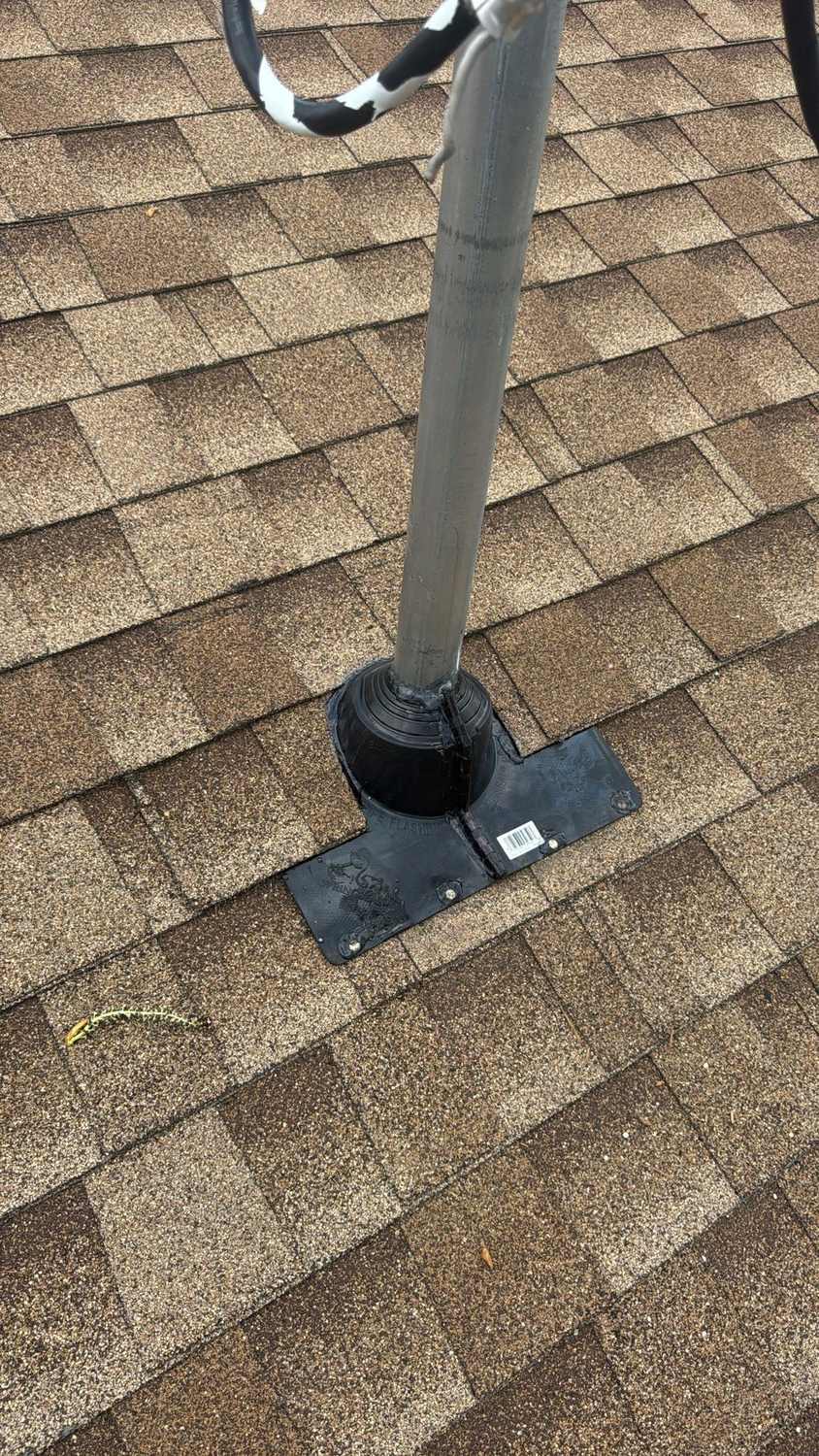 Flashing around a roof vent pipe on a shingle roof, a common place for roof leaks to start