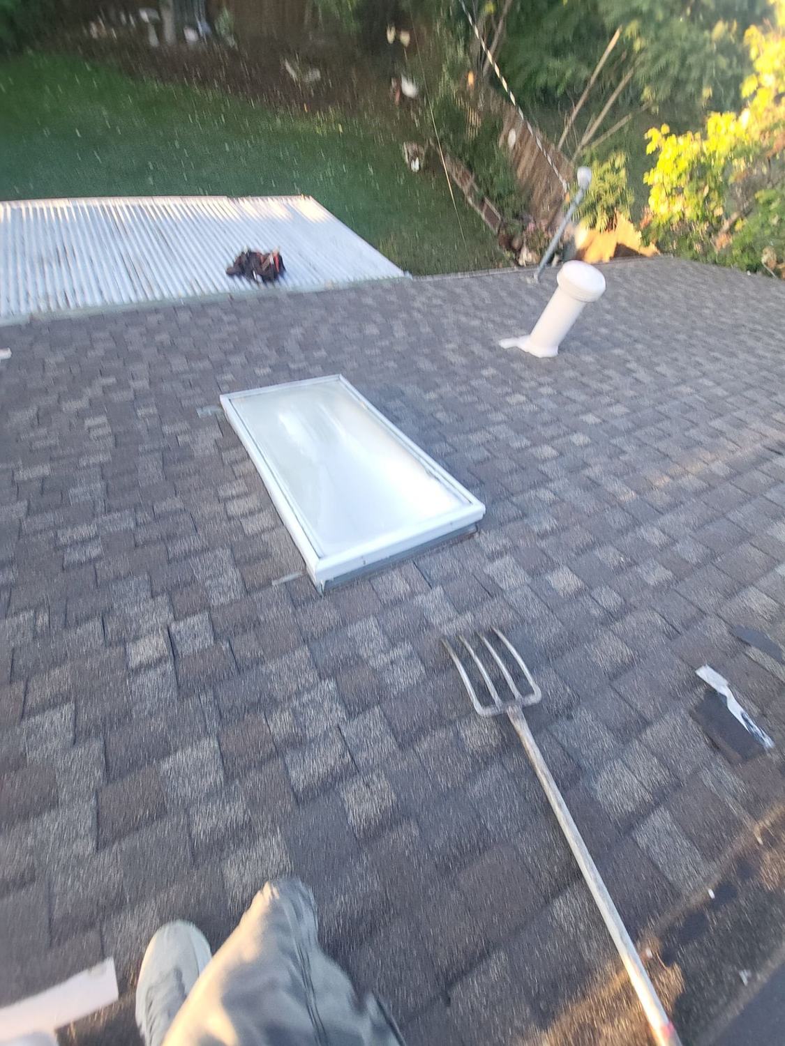 Existing skylight on the old roof during tear-off in Littleton, CO