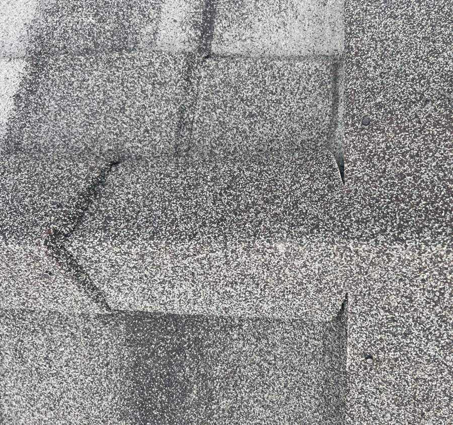 Close-up of Iron Wood stone-coated steel Cottage Shingle texture and panel overlap