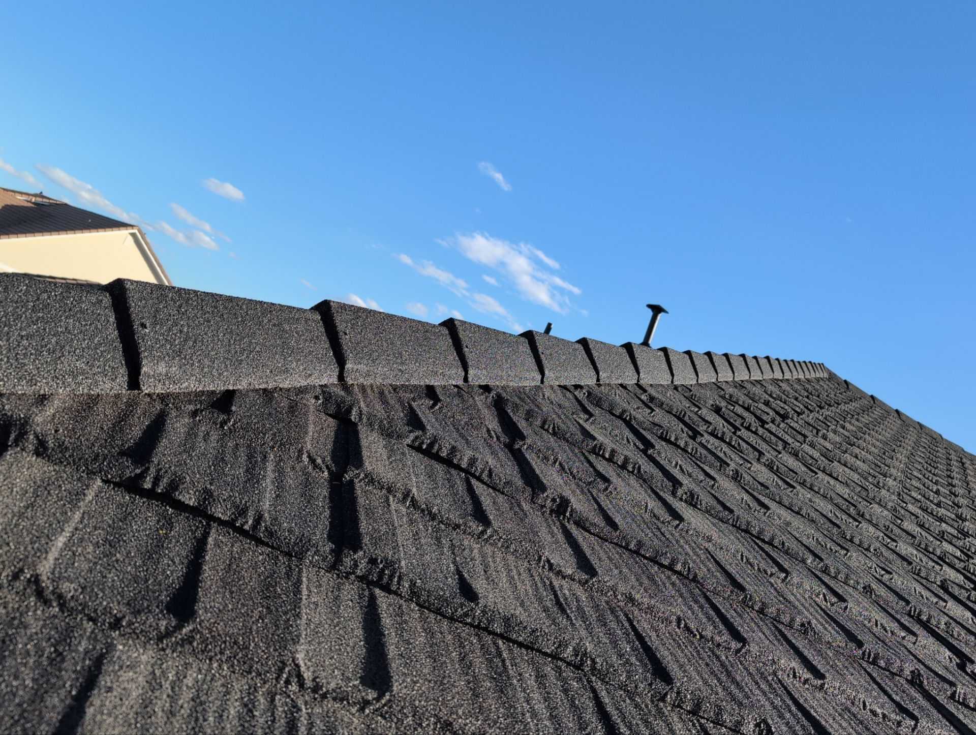 Close-up of the stone granule texture on Westlake Royal Cottage Shingle stone-coated steel panels