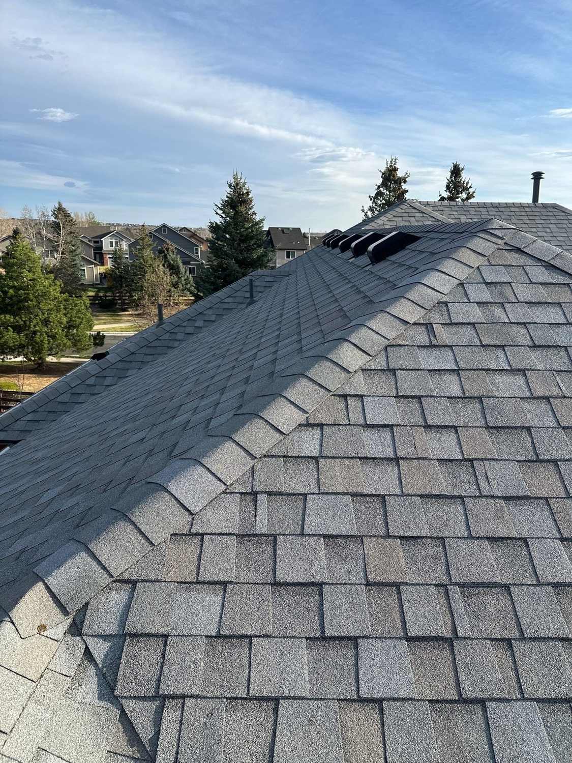 Hip and ridge detail on a TAMKO StormFighter Flex shingle roof in Arvada, CO