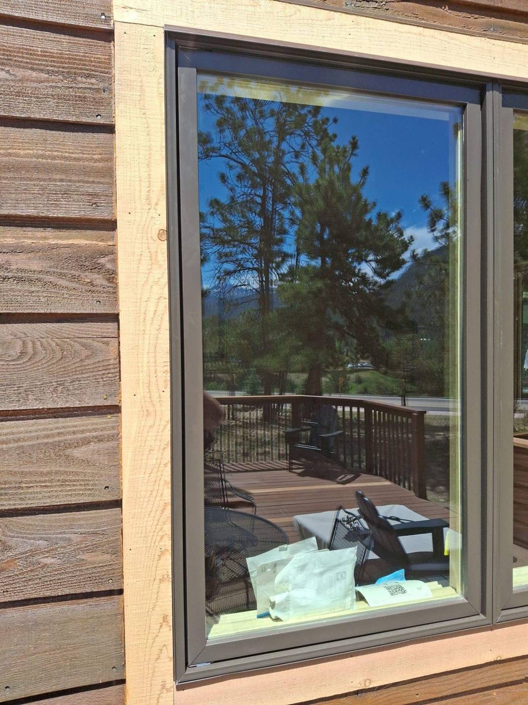 New clad-wood casement window set in trim boards during installation