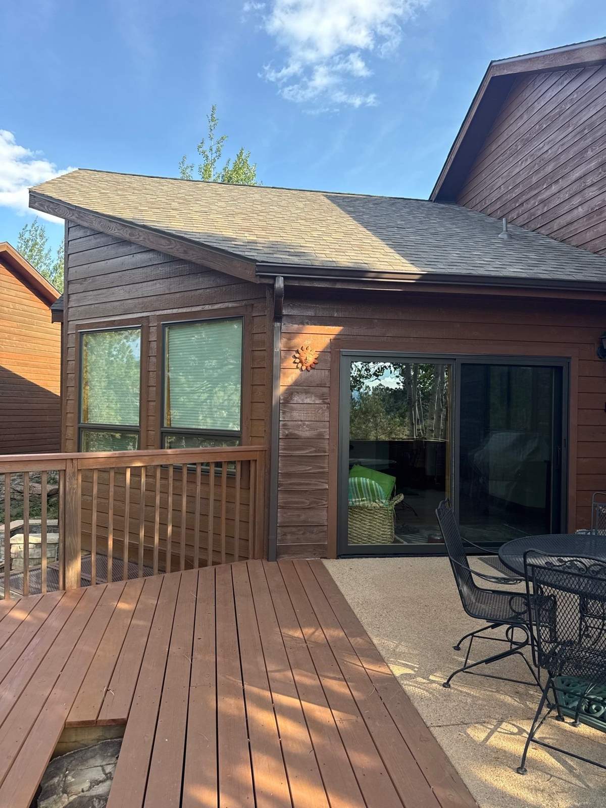 After window replacement: new bronze clad-wood windows and patio door
